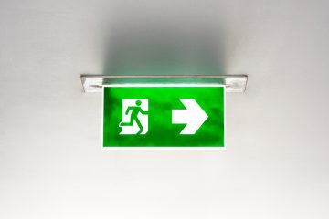 green emergency exit sign ceiling
