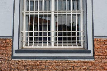 window security bars on brick wall